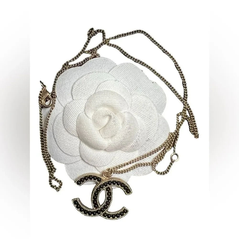Chanel gold and black pearl CC pendant necklace, Authentic